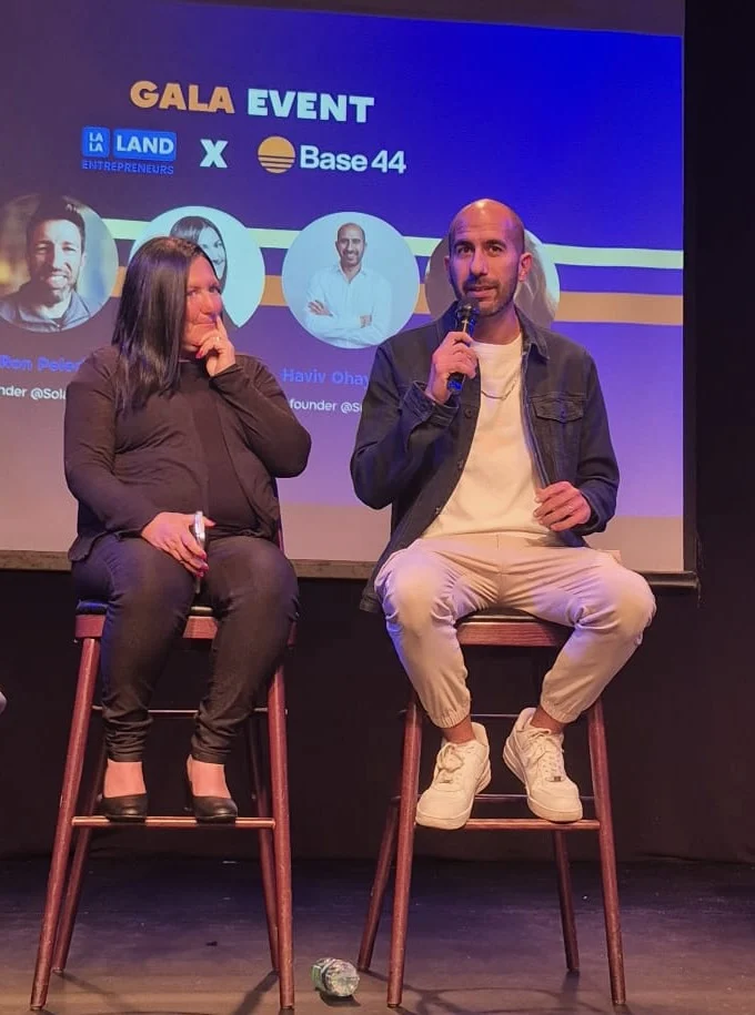 Haviv Ohayon speaking while seated on a gala event panel.